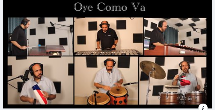 Image of Juan Alamo playing multiple percussion instruments